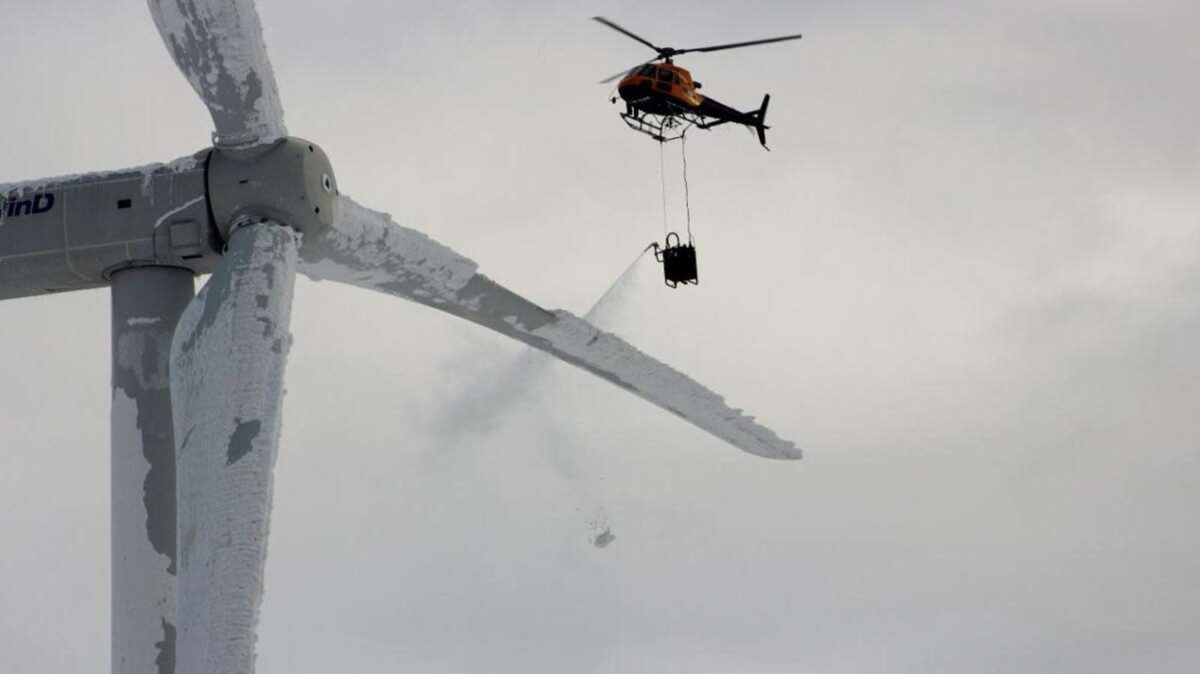 photo of an alpine helicopter test on a wind farm during winter
