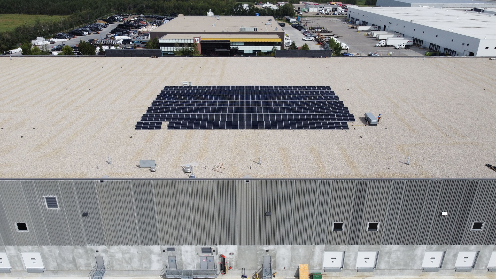 drone photo of solar panels on warehouse