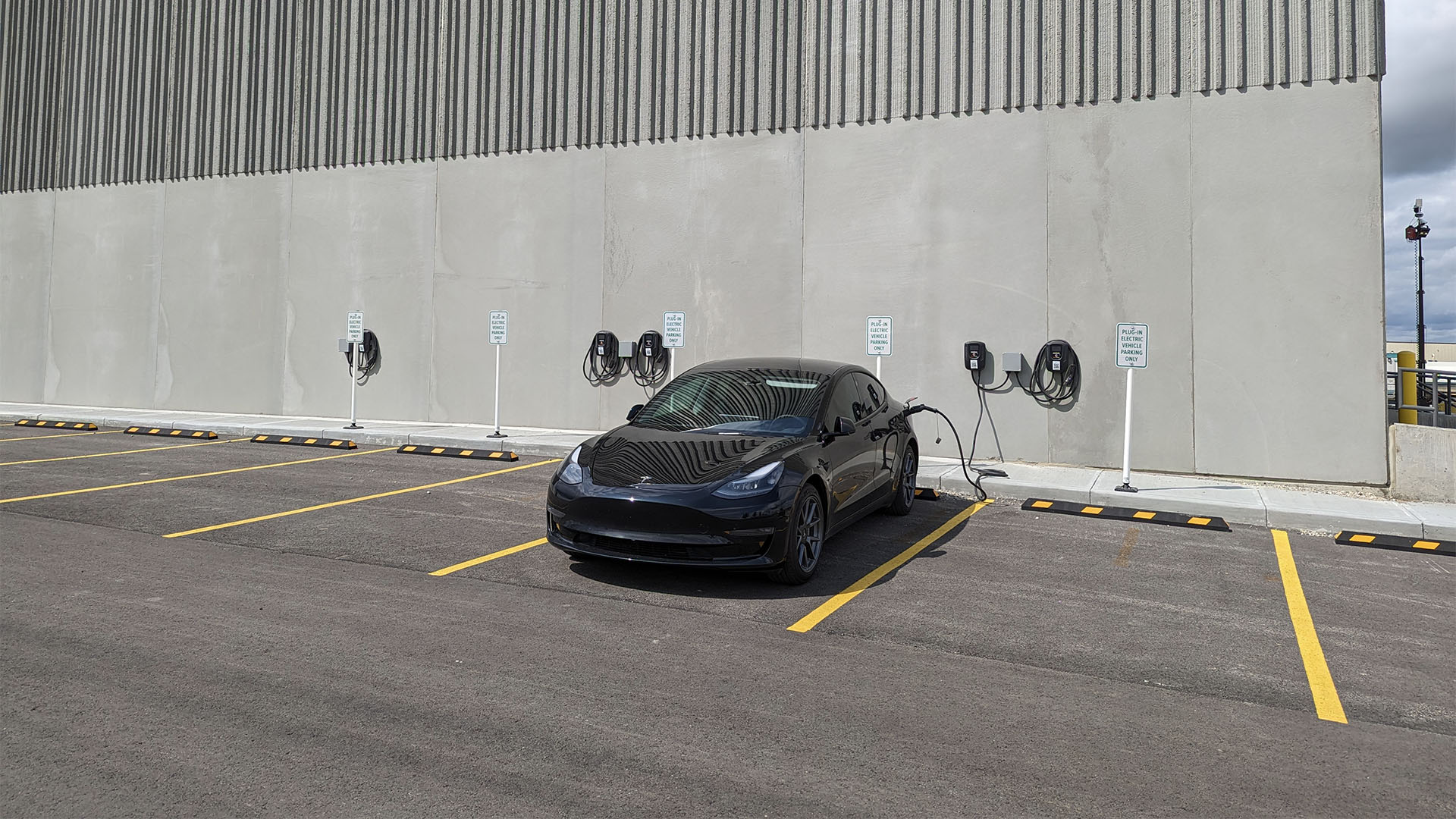 Tesla Model 3 charging with wall EV outlets