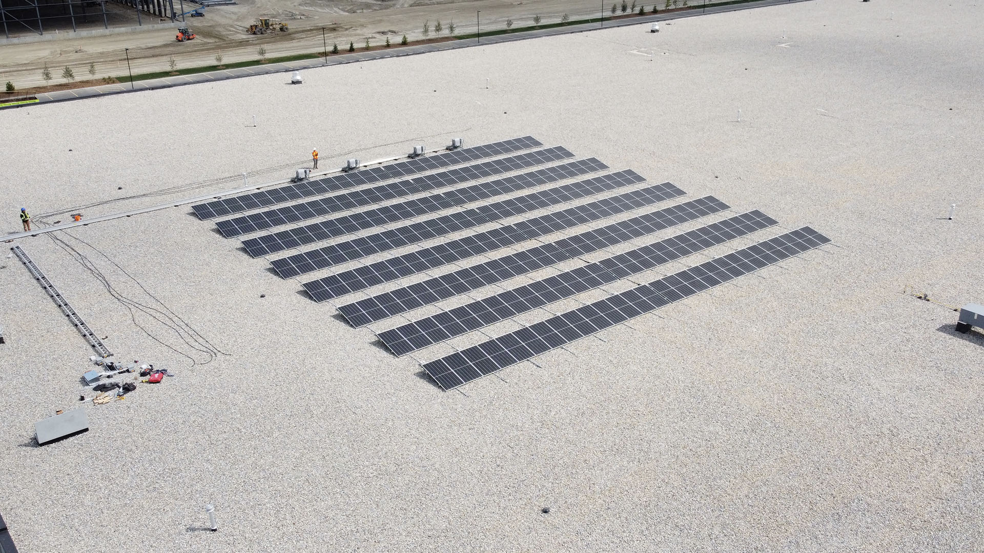 drone photo of solar panels on building roof