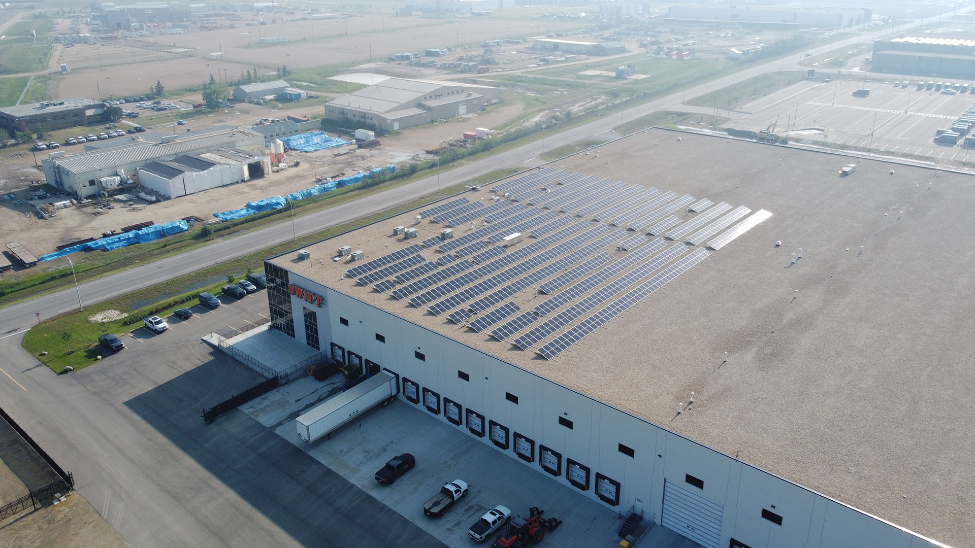 Drone shot of solar array on swift oilfield building