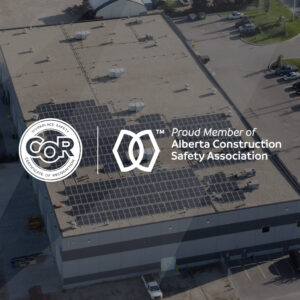 COR and ACSA logos in front of solar building