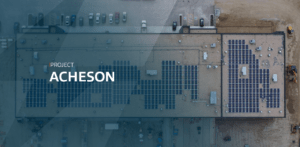 Drone shot of a solar array on top of a building with a blue gradient and text overlay
