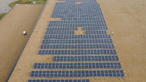 Drone shot of a solar array on top of a building