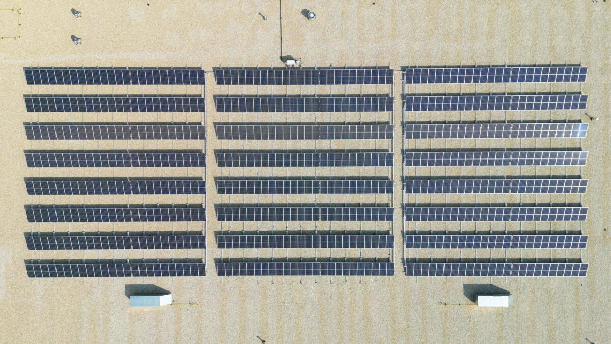 drone shot of solar panels on a roof