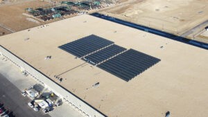 Wide drone photo of solar panels on a roof